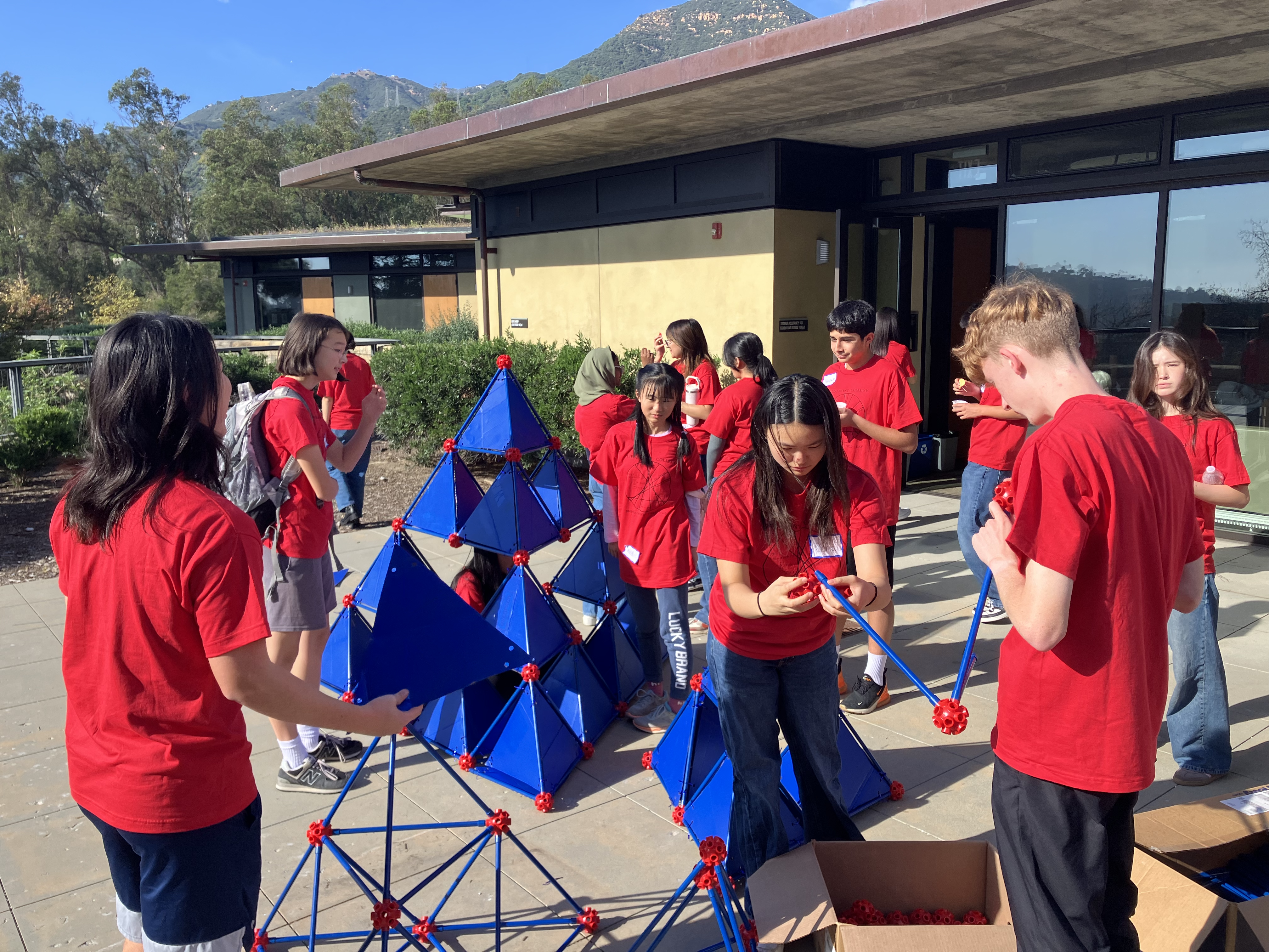Students work on a math construction together at Math Field Day