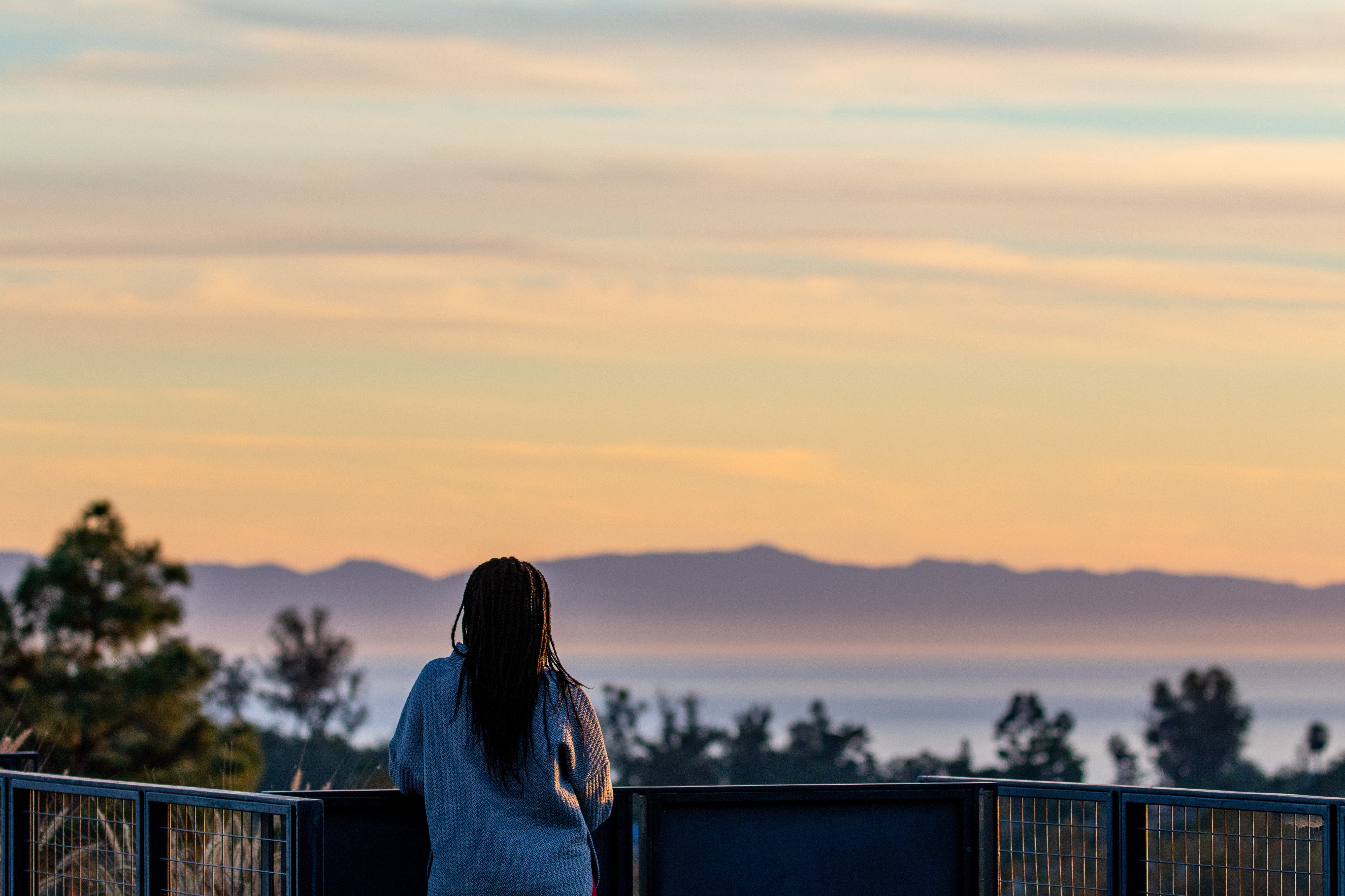 woman looking out at ocean view
