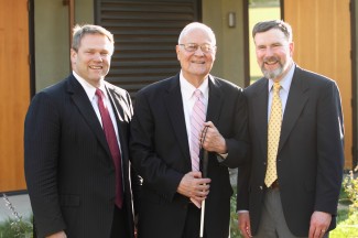 President Gayle D. Beebe poses outside Winter Hall with President Emeritus David Winter and former president Stan Gaede