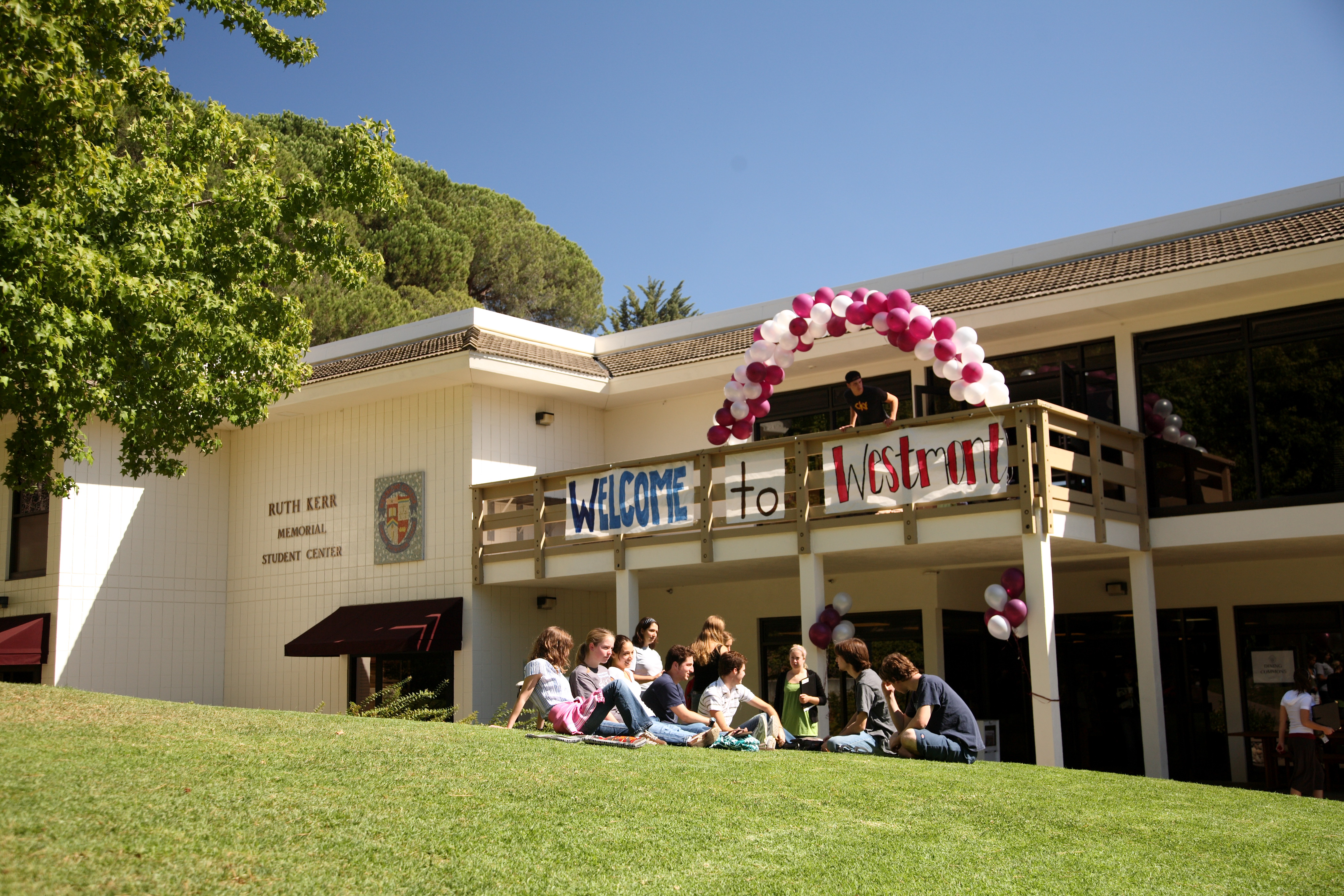 westmont students welcoming visitors with balloons