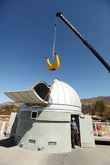 The Keck Telescope being lowered into the new observatory