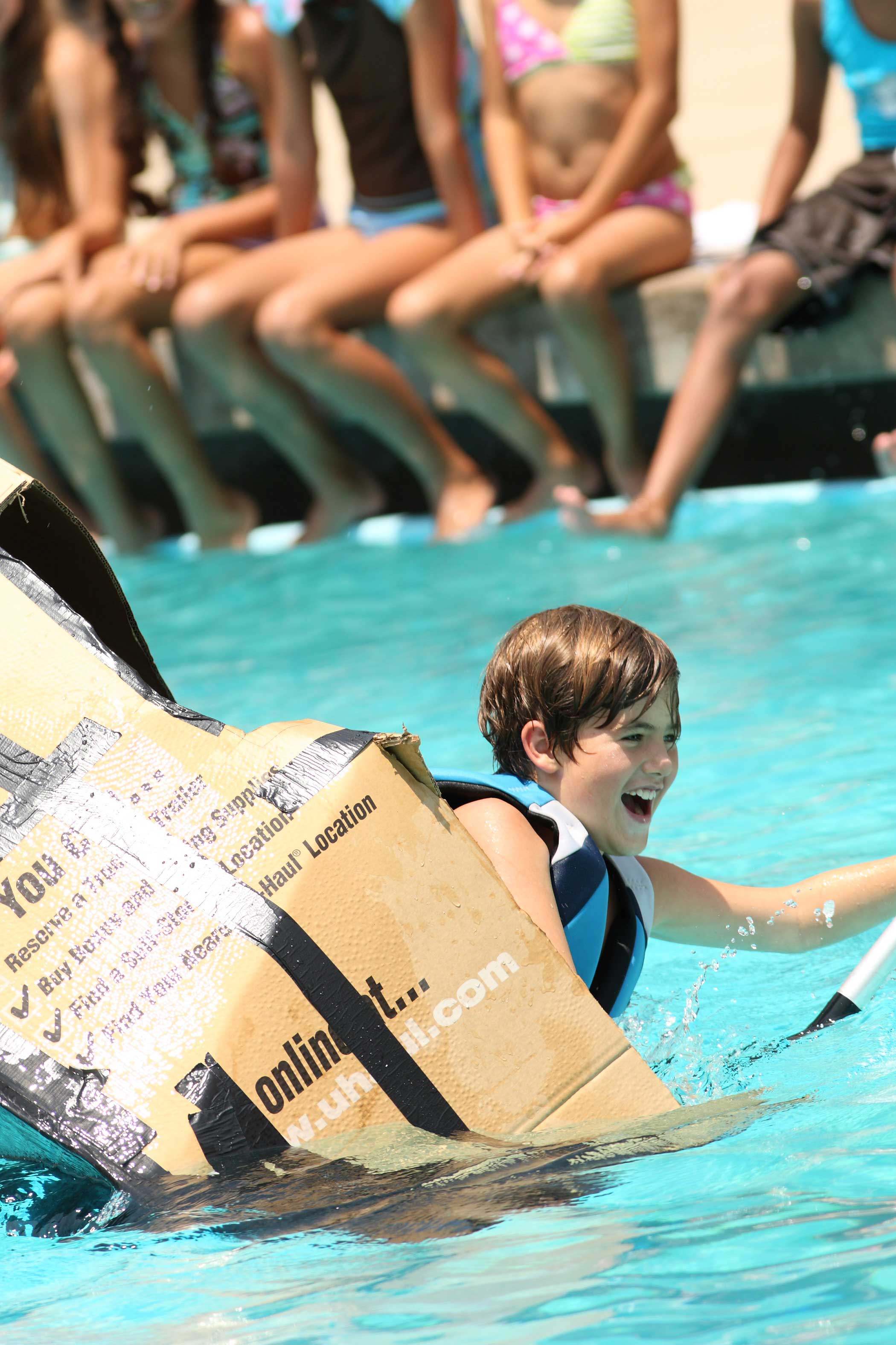 Camper Thomas Dawson in the Discovery Camp's cardboard boat race