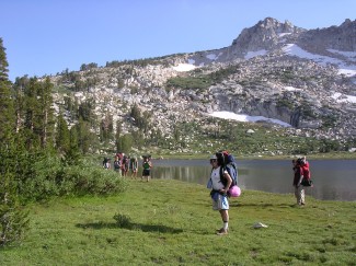 Students hike around the 9,882-foot-elevation Beartrap Lake in Toiyobe National Forest