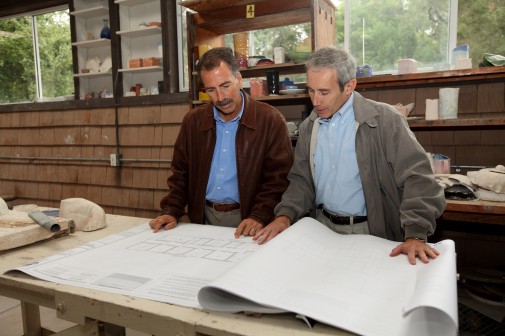 Randy Jones and Michael Shasberger look at blueprints of the new music building