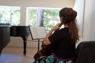 Student Rebecca Shasberger practices inside the new music building