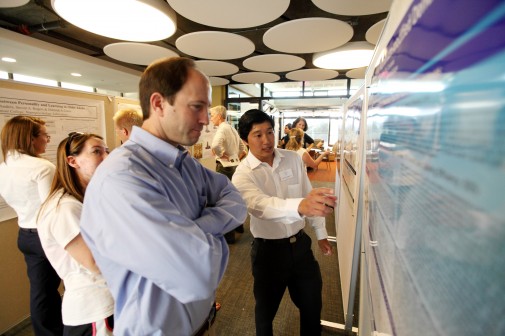 Jeffrey Kuwahara ‘11, a double major in chemistry and biology, explains his research to Professor Steve Julio
