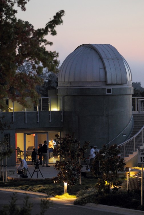 Volunteers begin setting up their telescopes at the Westmont observatory at dusk