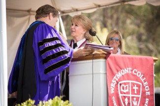 President Gayle Beebe gives the Westmont Medal to Annette Simmons with Amy Simmons nearby
