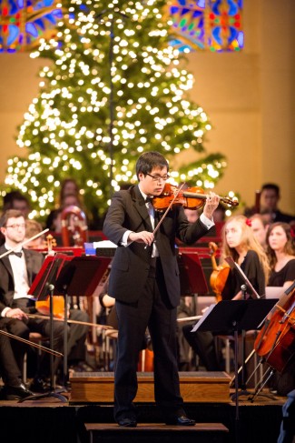 Violinist Han Soo Kim performs during the Christmas Festival