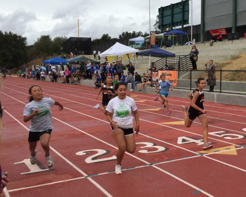 Brenda Castro of Washington wins her heat in the girls 80-meter race