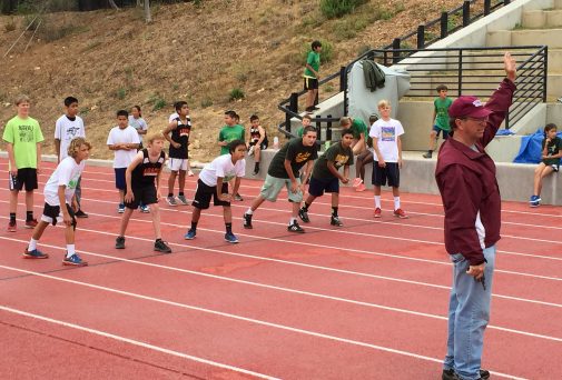 Coach Russell Smelley starts the boys 80 meter race