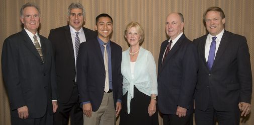 Stefan Inouye with coaches John Moore and Jeff Azain, the Jordano's and President Beebe