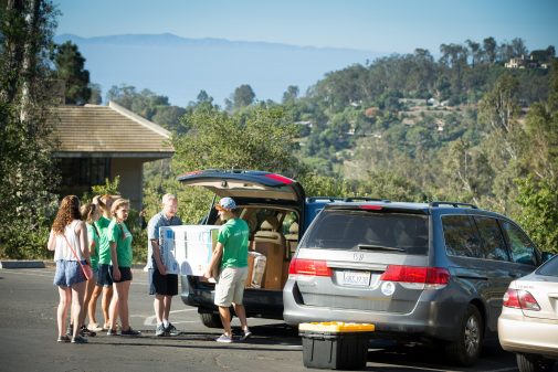 Orientation team members help new students move into Page Hall