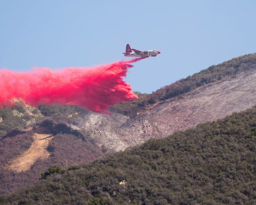 Air Tanker 14, a Lockheed P-2 Neptune, dumps phos-check on the Gibraltar Fire