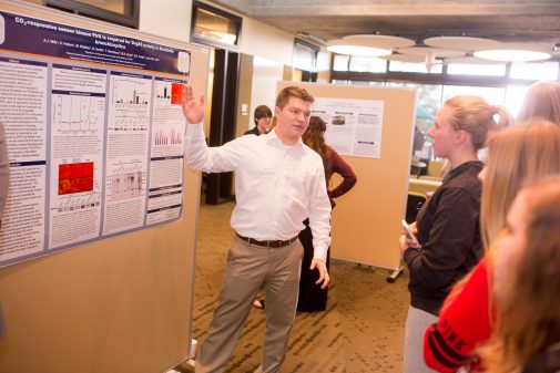Kirk Fetters, a triple major in biology, chemistry and kinesiology, explains his research in 2015