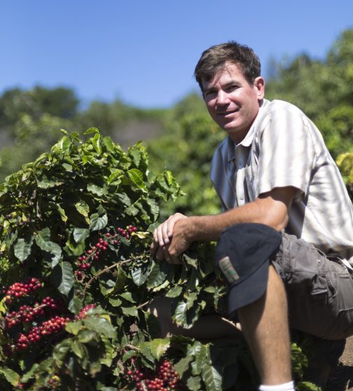 Jay Ruskey with one of his coffee plants (photo by Michelle Nunes)