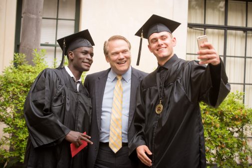 Davies Kabogoza poses for a selfie with President Gayle D. Beebe and Graylin Derke '16 at Commencement