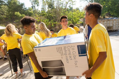 Westmont athletes help new students move into their residence halls.
