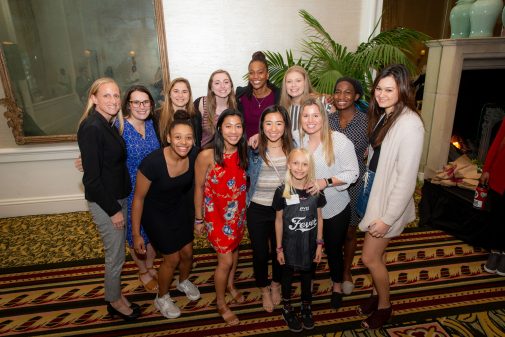 The Westmont women's basketball team poses with Tamika Catchings