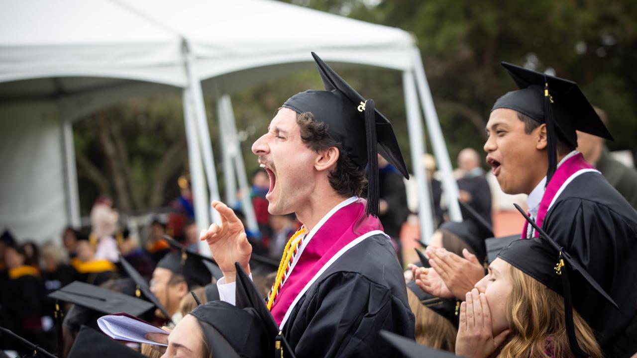 westmont Commencement 2025 male students standing and cheering