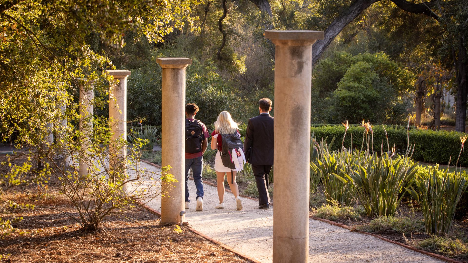 Westmont students walking with professor on campus