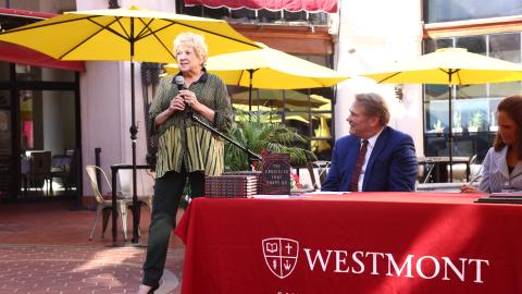 women speaking at president beebe's book signing