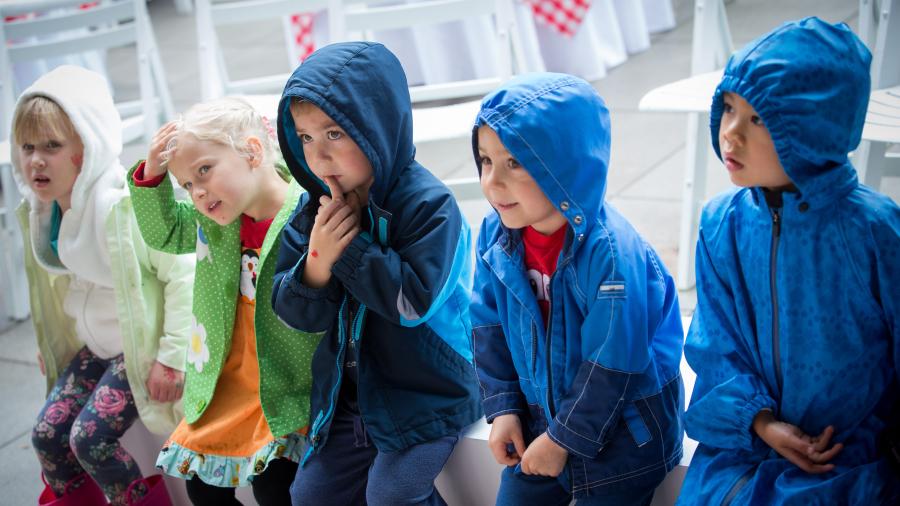 Kids in raincoats at Family Day.