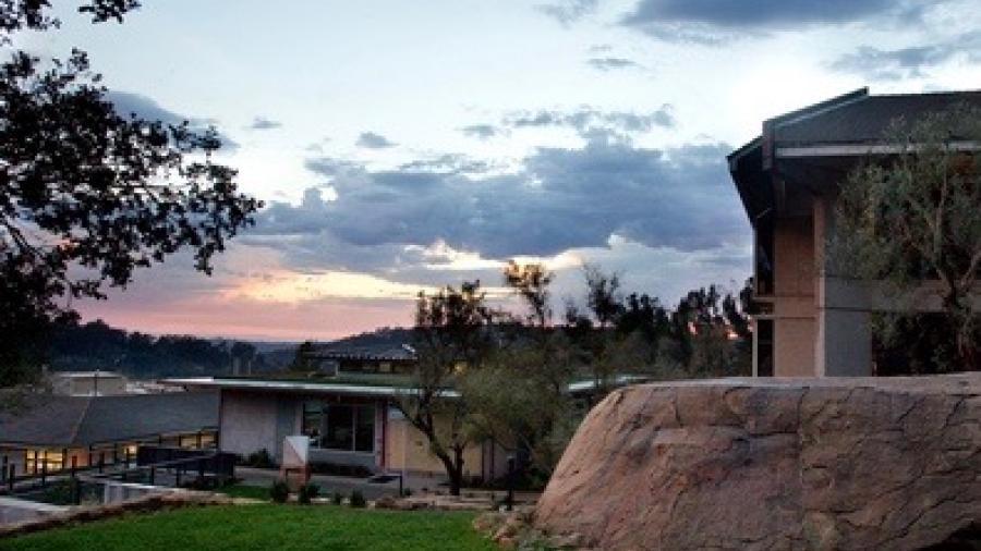 Westmont cloudy sunset by rock and library