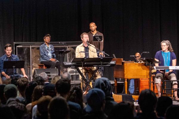 Dave LeMieux performs at the table with Dr. King