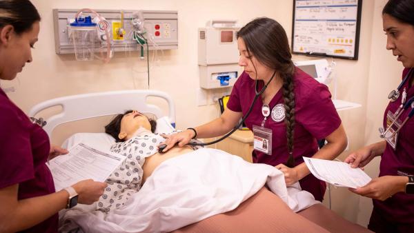 Westmont nursing students work on a patient