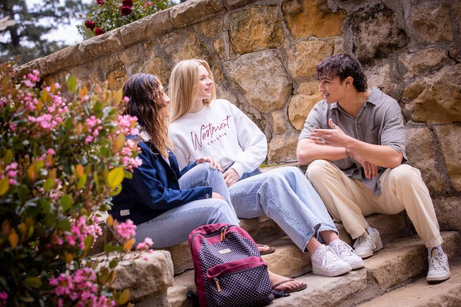 Westmont students chat on the stairs near Magnolia Lawn