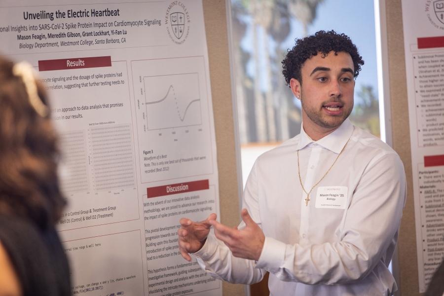 Senior Mason Feagin explains his biology research